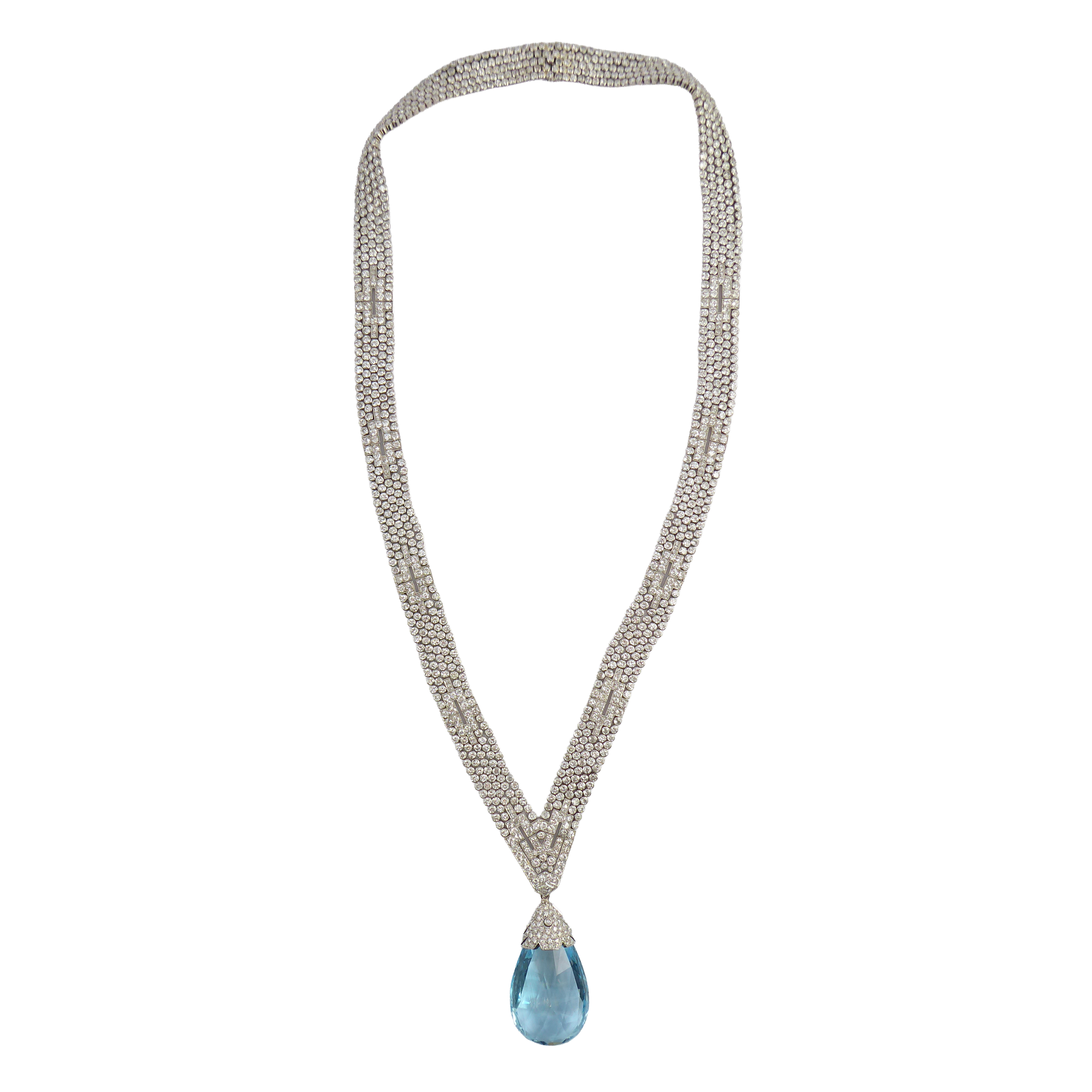 Art Deco articulated diamond strap sautoir and aquamarine briolette pendant necklace, French c.1925, of geometric design, the diamond ribbon strands converging to a pronounced V-shaped front, suspending a large aquamarine drop of briolette cut,